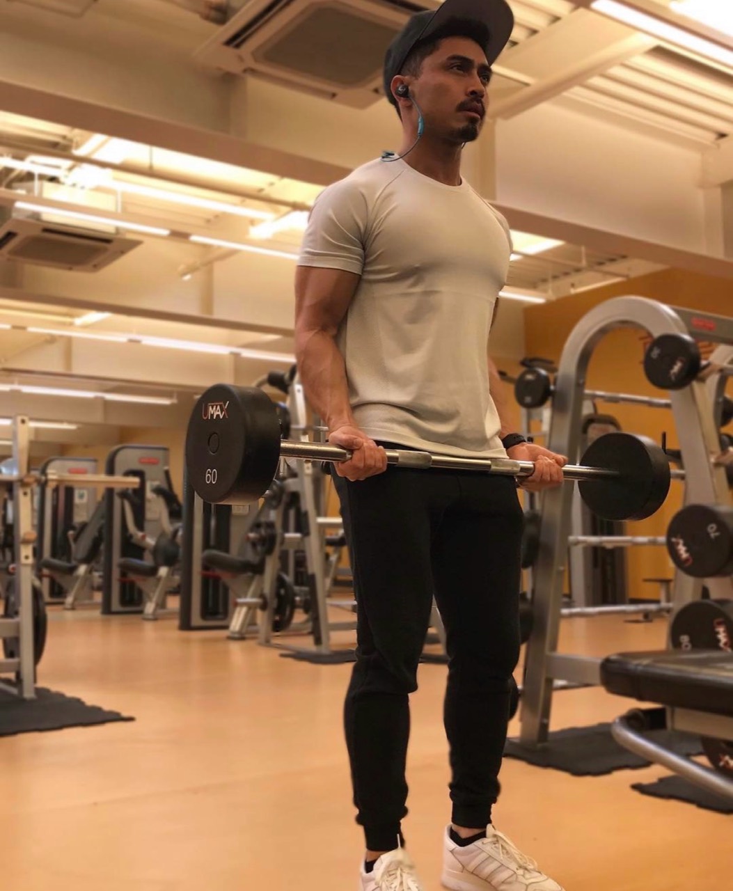 Benjamin training with a barbell in the gym