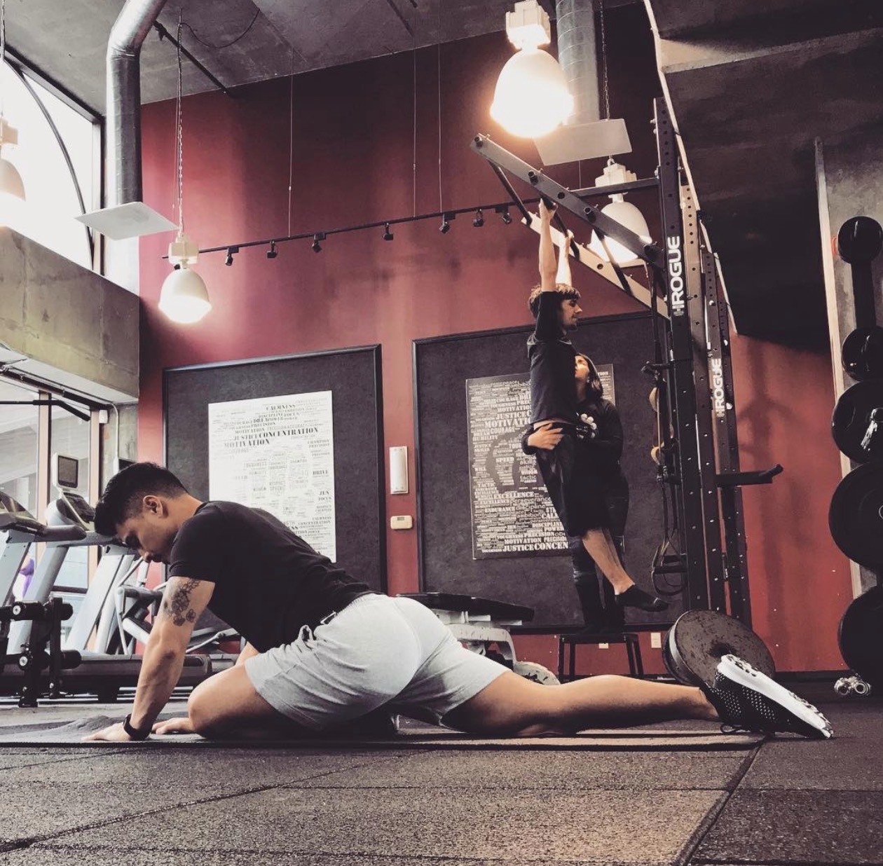 Benjamin stretching and coaching in the gym